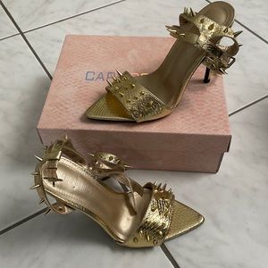 Never worn! Gold spikey heels